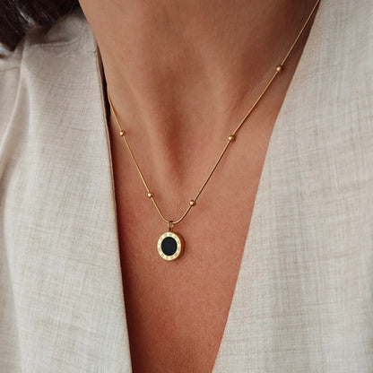 Двустранно колие, стомана с 14-каратово покритие, черен или перлен циферблат